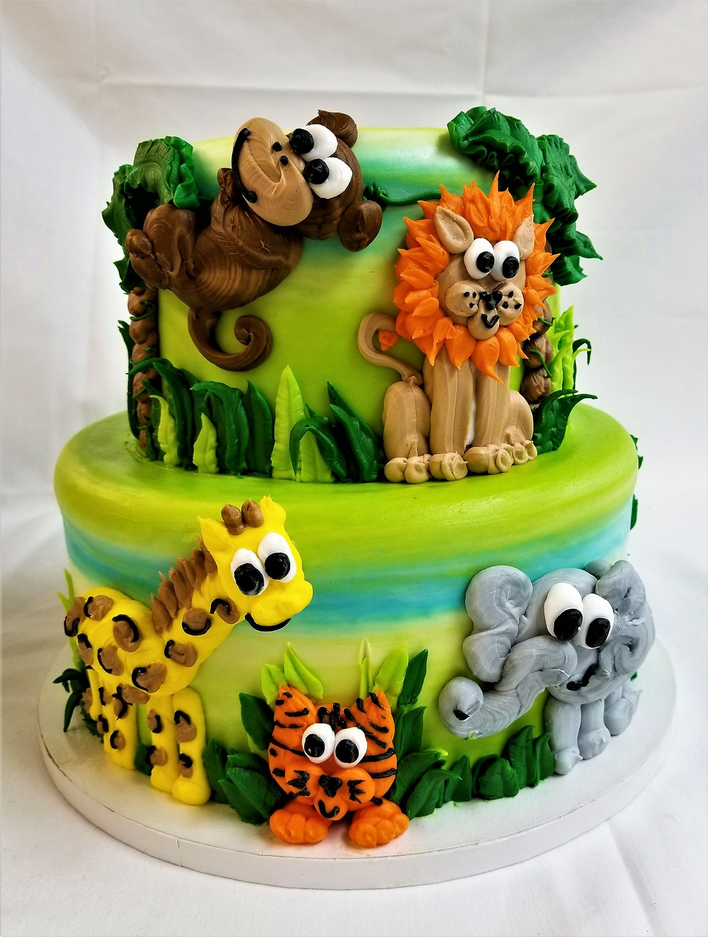 Animal Birthday Cakes
 Safari Animals celebration cake from Cinotti s Bakery