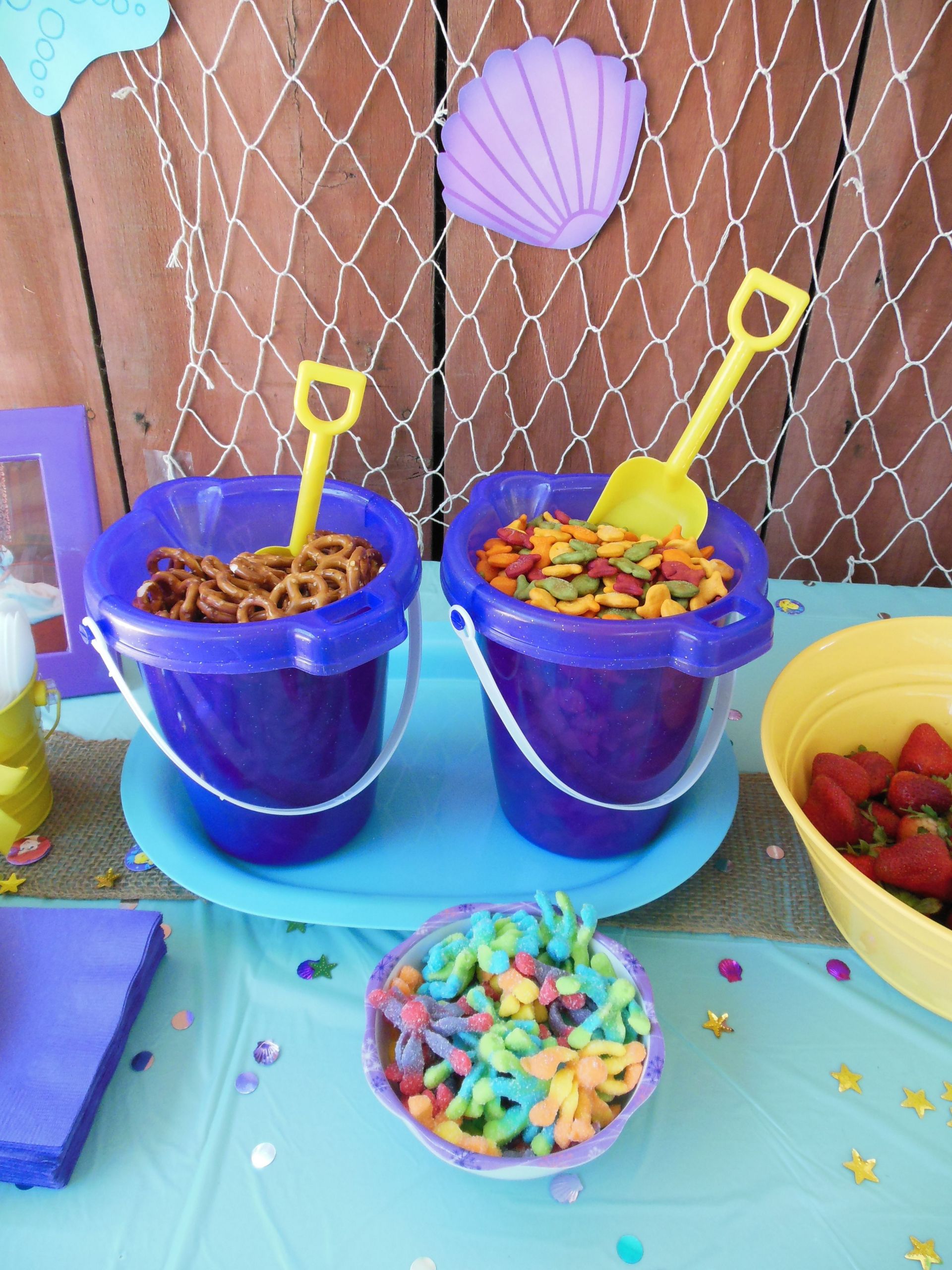 Beach Party Snack Ideas
 ocean party snacks out of a sand pail