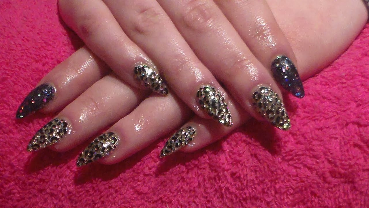 Black Acrylic Nails With Glitter
 Black and Gold Glitter with leopard print Acrylic nails
