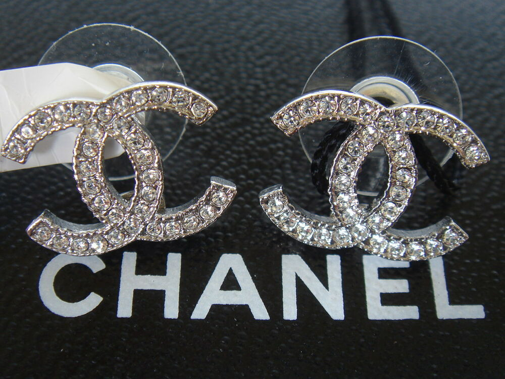 Chanel Cc Logo Earrings
 AUTHENTIC BRAND NEW SILVER CHANEL LARGE CC LOGO CRYSTAL