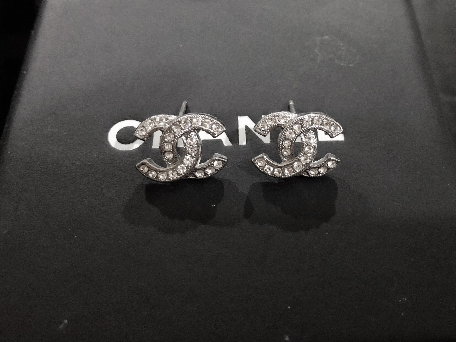 Chanel Cc Logo Earrings
 Authentic Chanel Classic CC Logo Crystal Strass Silver