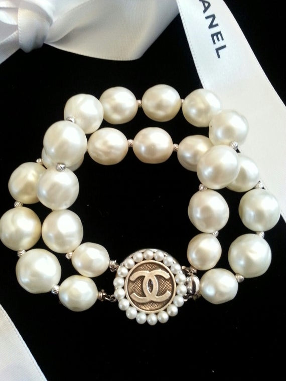 Chanel Pearl Bracelet
 Items similar to Authentic Chanel Button Pearl Bracelet