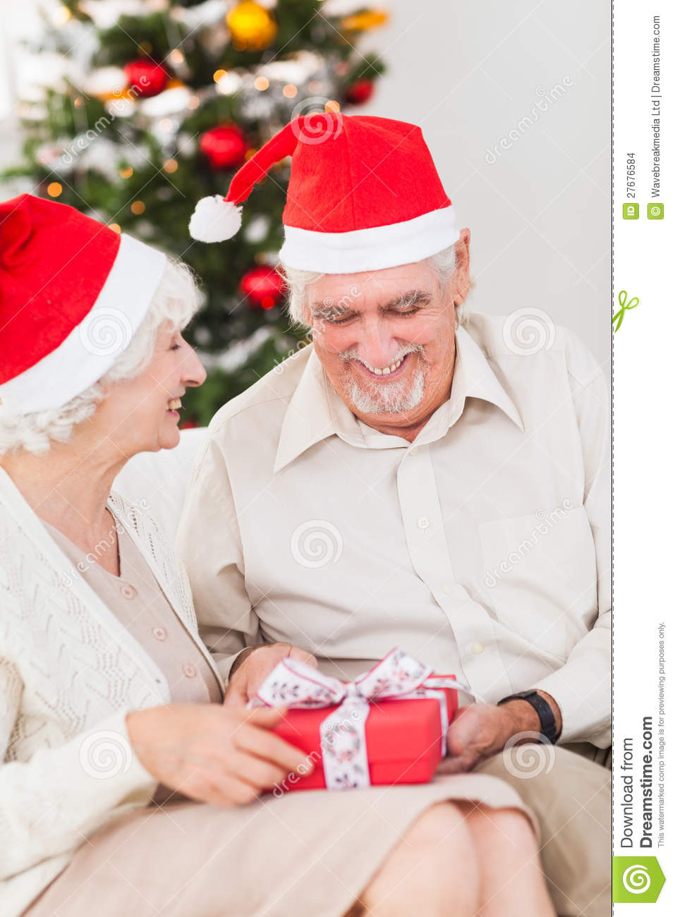 Christmas Gift Ideas For Older Couple
 Elderly Couple Swapping Christmas Presents Stock