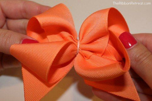 DIY Boutique Hair Bow
 Tighten thread and wrap three times and stitch in the back