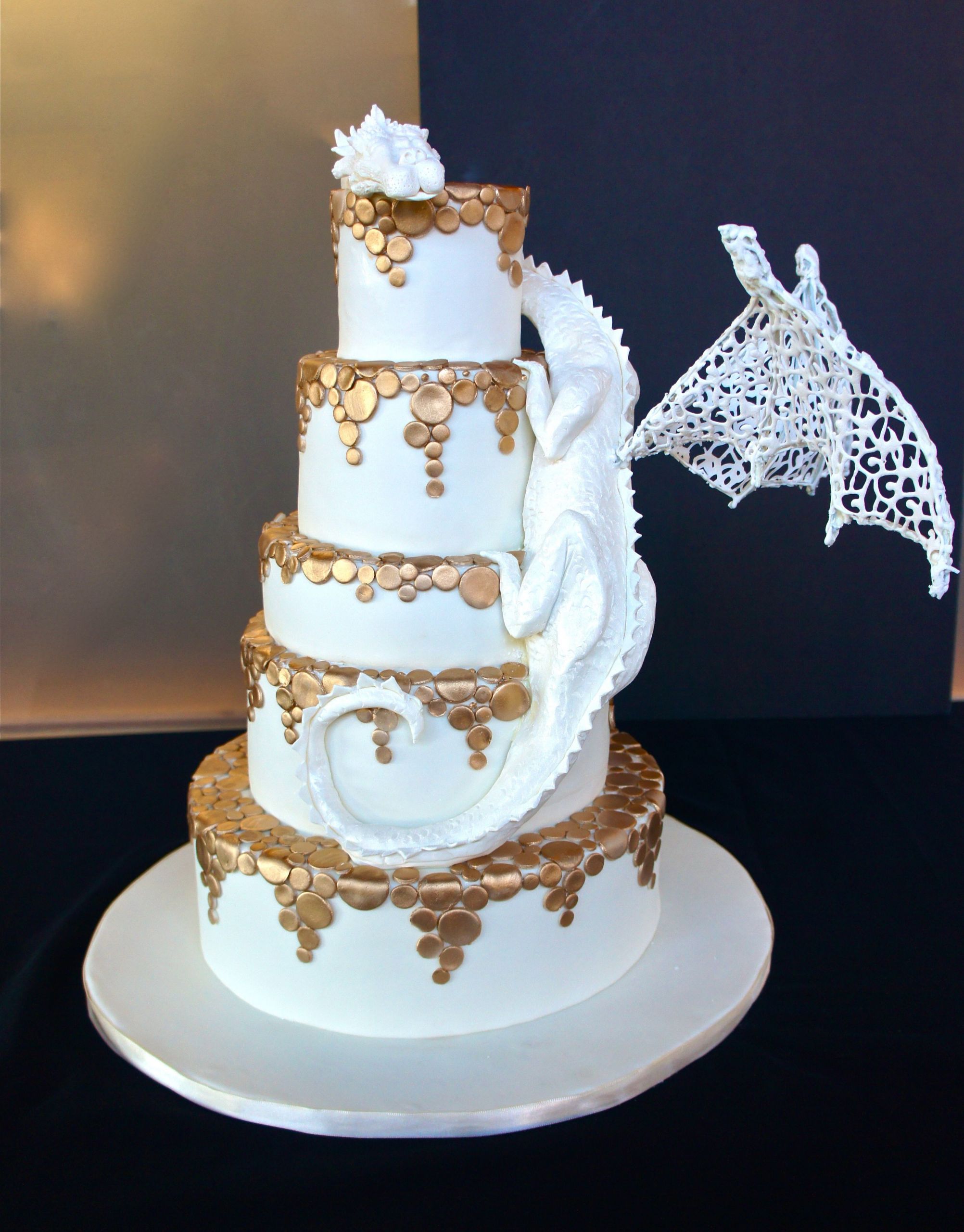 Dragon Wedding Cakes
 White chocolate dragon wedding cake with gold falling