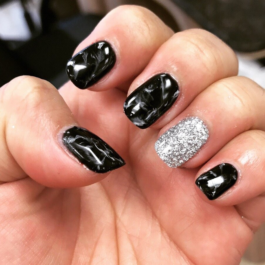 Glitter Dip Nails
 Black and White marble gel nails with the dip glitter