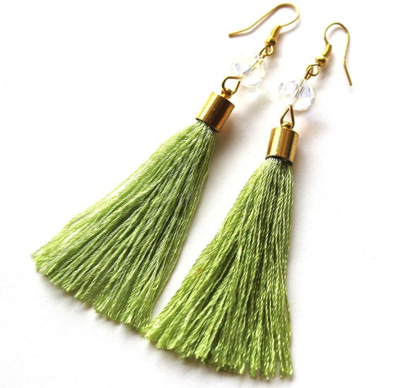 Green Tassel Earrings
 Lime green thread tassel and clear bead golden earrings