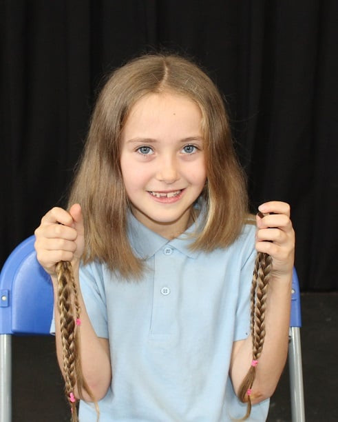 Hair For Kids With Cancer
 Newington pupil Amelia has locks chopped to help children