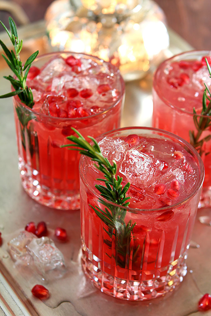 Holiday Gin Drinks
 Pomegranate and Rosemary Gin Fizz Cocktails DrinkWire