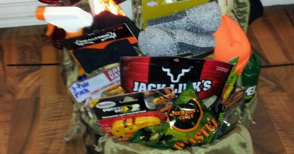 Hunting Gift Basket Ideas
 Hunting Basket idea for raffle Camo backpack zip tied to