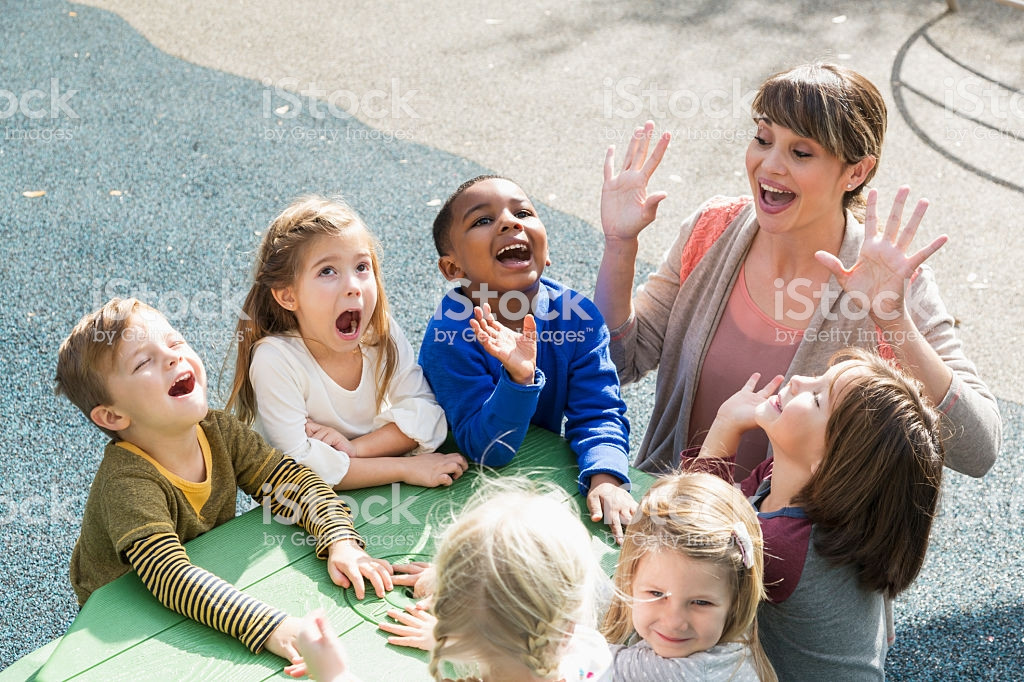 Kids And Fun
 Teacher With Preschool Children Having Fun Stock