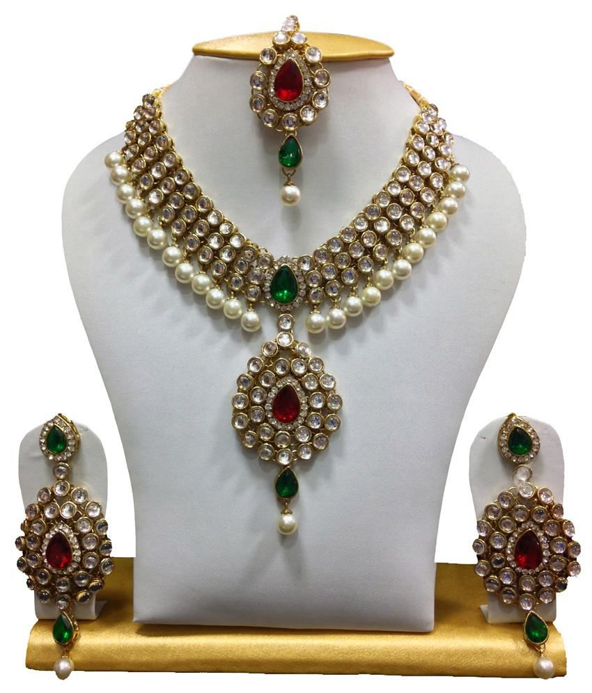 Kundan Necklace Sets
 Mokanc Dazzling kundan set in Red and Green Stones and