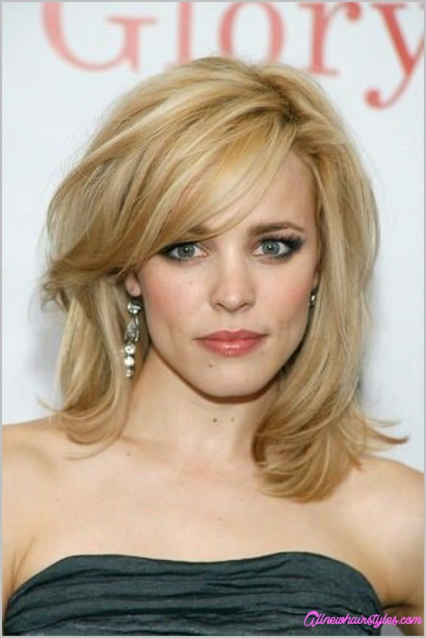 Medium Hairstyle With Side Bangs
 Medium length haircuts with side swept bangs and layers
