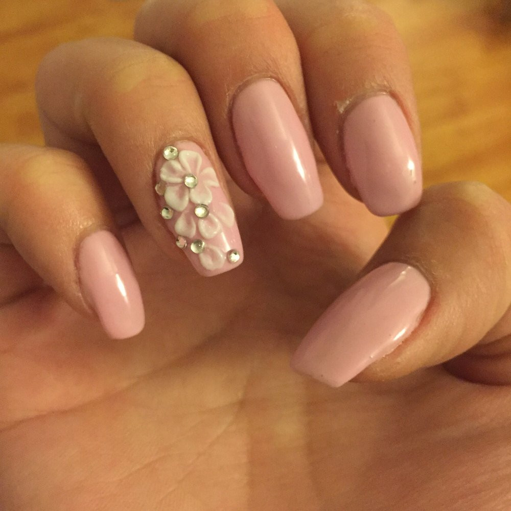 Natural Nail Styles
 Pink gels with white 3D nail art with jewels on natural