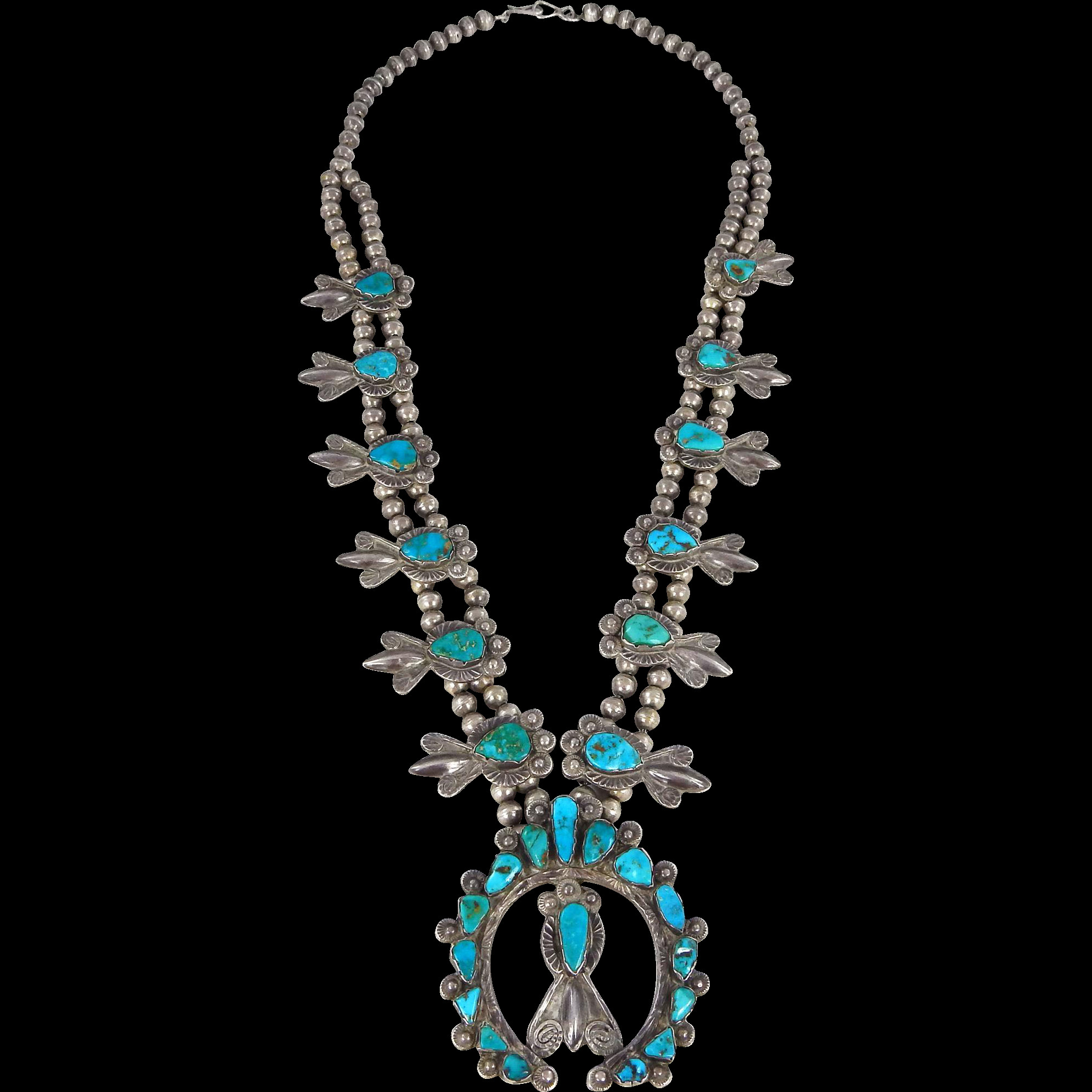 Necklaces With Charms
 ZUNI DAN SIMPLICIO Sterling & Turquoise Squash Blossom