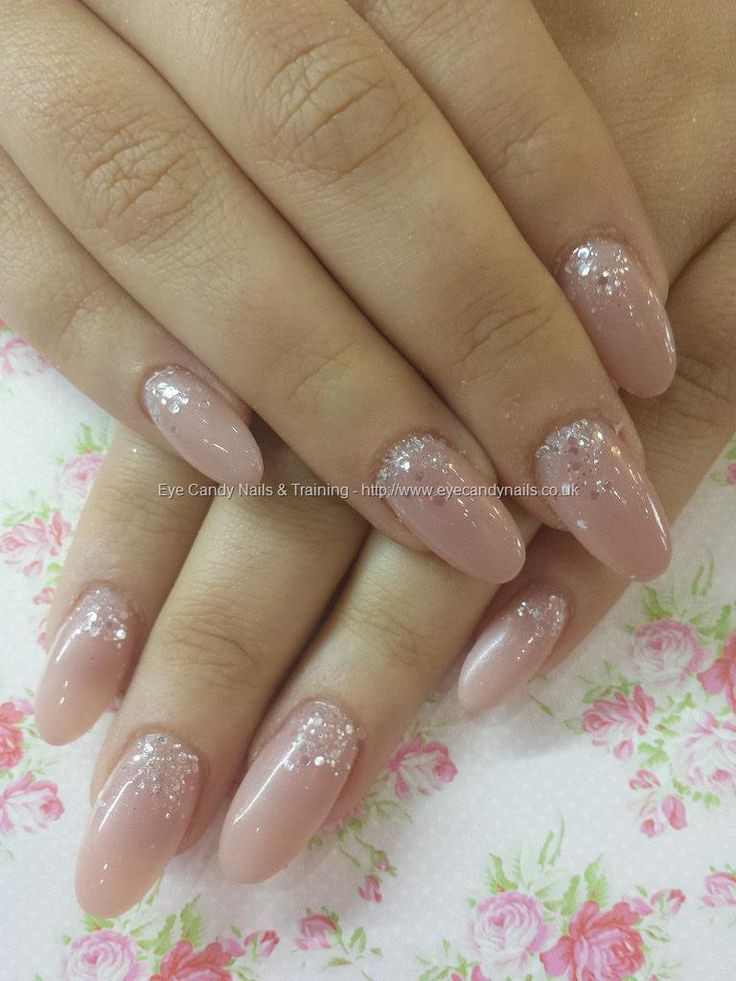 Nude And Glitter Nails
 Toffee acrylic with silver disco ball glitter