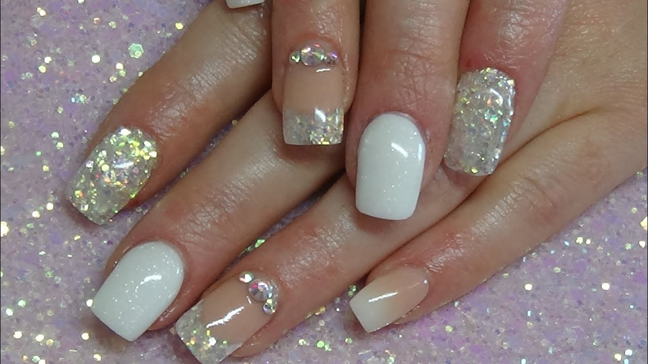 Nude And Glitter Nails
 white & acrylic nails CJP products
