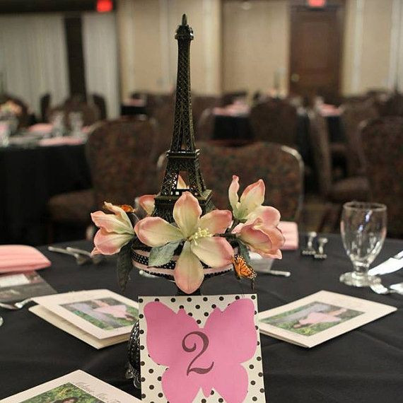 Paris Themed Graduation Party Ideas
 Eiffel Tower Centerpiece with butterflies and flowers by