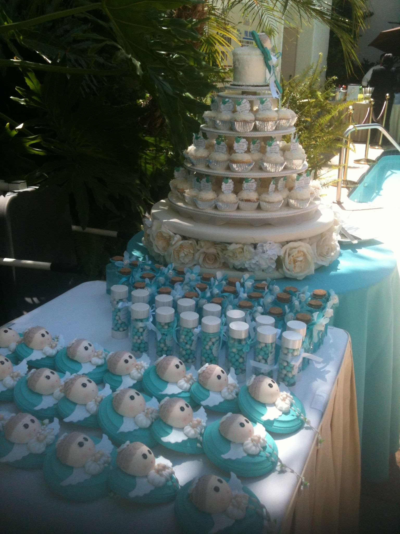 Pool Party Decoration Ideas Adults
 Cupcake tower and party favors Baptism held at Anabella