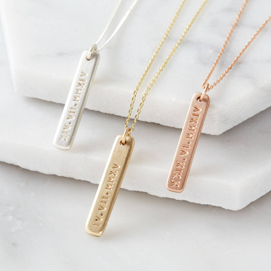 Roman Numeral Necklace
 9ct gold roman numeral tiny bar necklace by notes