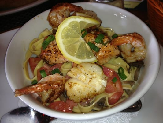 Shrimp And Scallop Pasta With White Wine Sauce
 Seafood Pasta with salmon diver scallops and shrimp in a