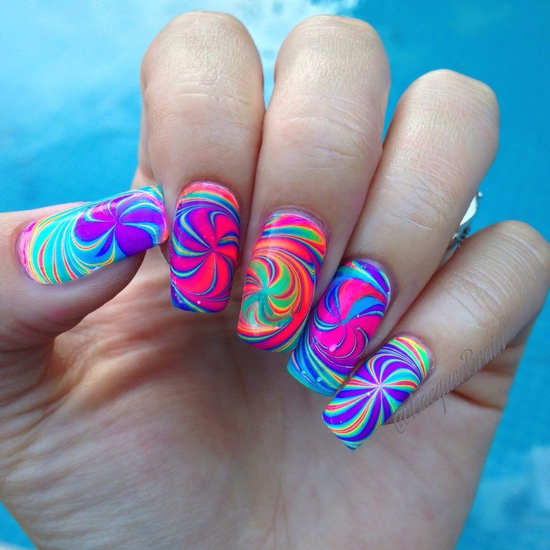 Trippy Nail Art
 Psychedelic pinwheel watermarble nail art by Lilly
