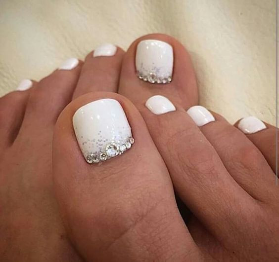 White And Silver Glitter Nails
 Picture white nails with silver glitter and beads on