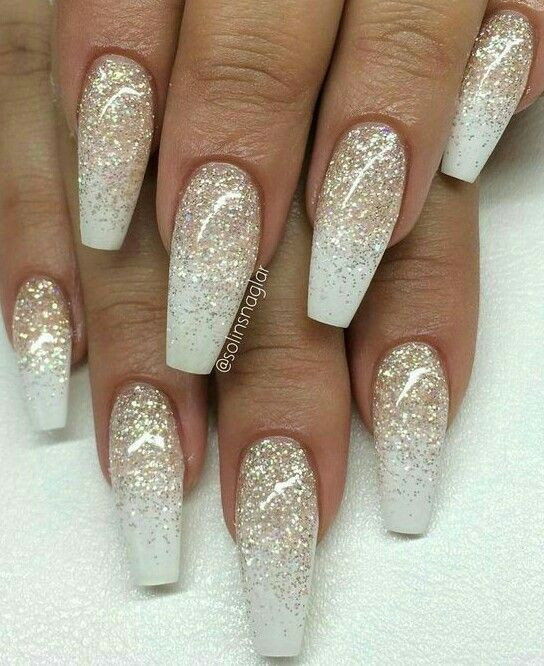 White Nails With Silver Glitter
 Coffin shaped white ivory color with gold sparkles