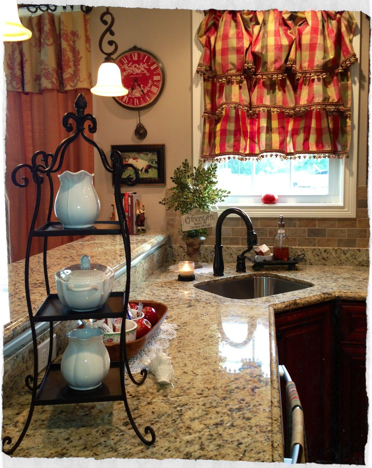 Cute Kitchen Curtains
 Cute cozy kitchen with beverage condiments on a tier