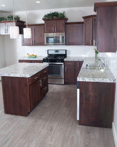 Gray Hardwood Floors In Kitchen
 Knotty Alder Cabinets mccoy flagship 2 0094 in 2019