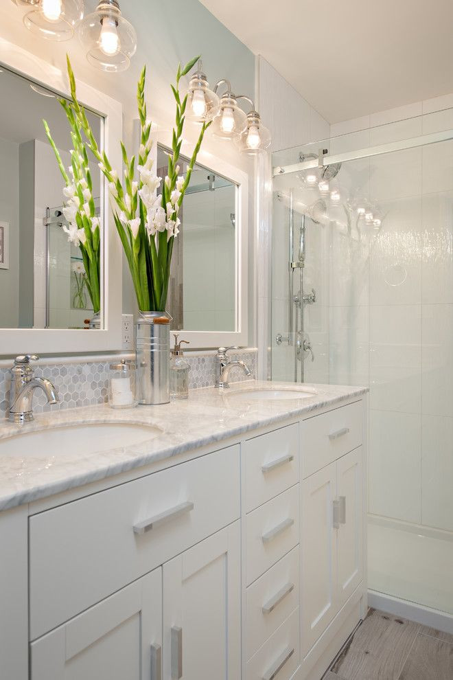 Small Bathroom Mirror Ideas
 small bathroom with white cabinets under two white sinks
