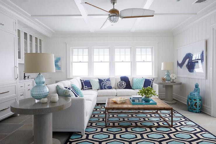 Turquoise Rug Living Room
 Natural Linen Skirted Sofa with navy and Turquoise Fan
