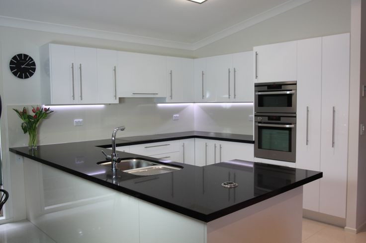 White Kitchen Bench
 Black benchtop white cupboards Classic style that never