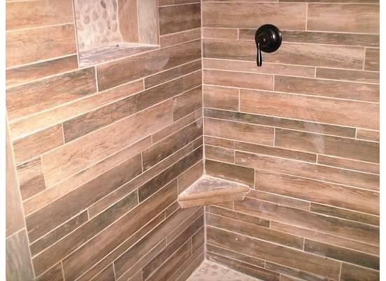 Wood Grain Tile Bathroom
 Wood grain tile in shower with white river rock