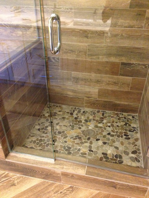 Wood Look Tile Bathrooms
 Shower remodel Natural look with mosaic flat rock pebbles